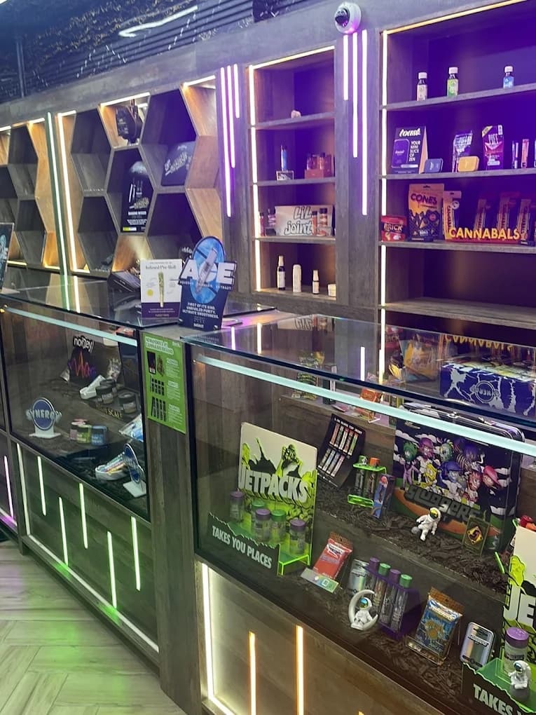 Neon-lit hexagon shelving and glass cases